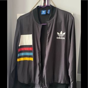 Adidas lightweight track jacket. Size large in womens. Mint condition.